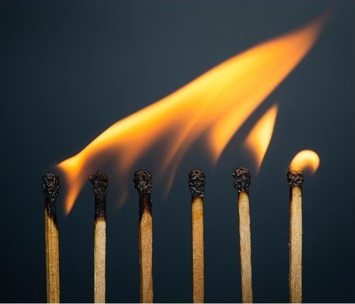 several matches in a line, with tips burning