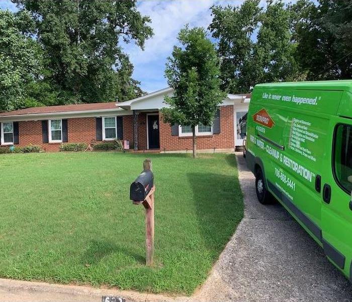 SERVPRO vehicle parked in driveway of home