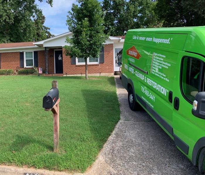 A home with a SERVPRO vehicle in the driveway. 